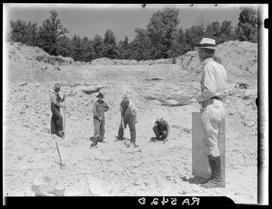 Farmers resettled on Skyline Farms, Alabama, at work in sand quarry under supervision of project manager