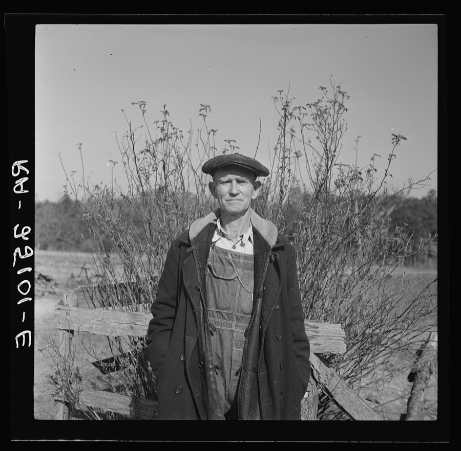 Tenant farmer at well. Walker County, Alabama