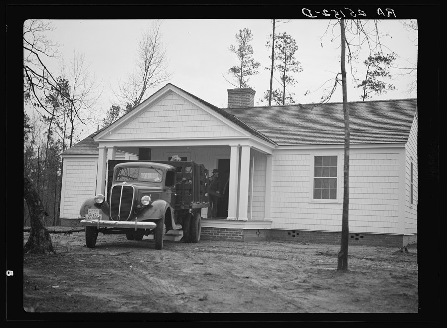 The Kelley family's furniture being moved into a new home at Bankhead Farms, Alabama