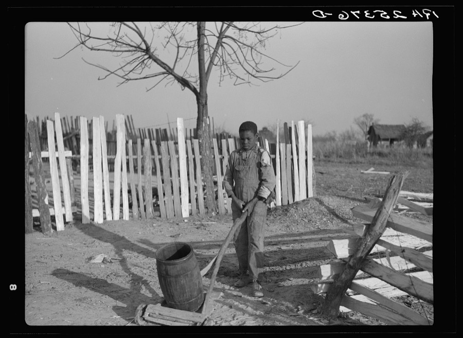 Boy hauling water. Gees Bend, Alabama