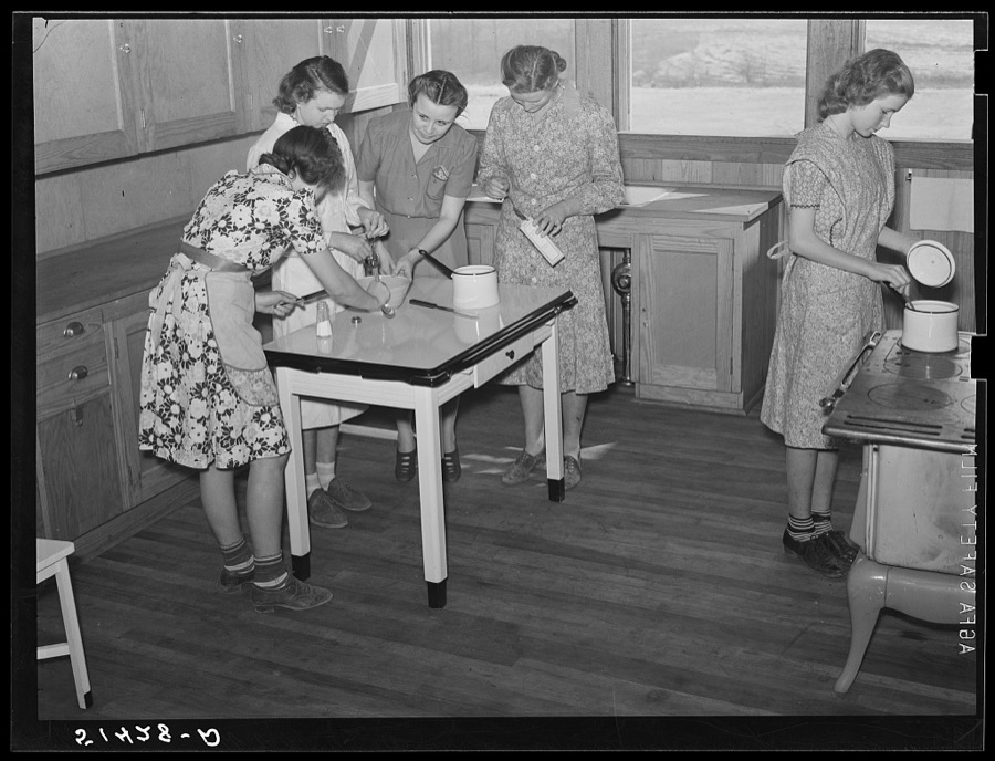 Cooking teacher and group of girls in home economics classroom. Coffee County, Alabama. Goodman School