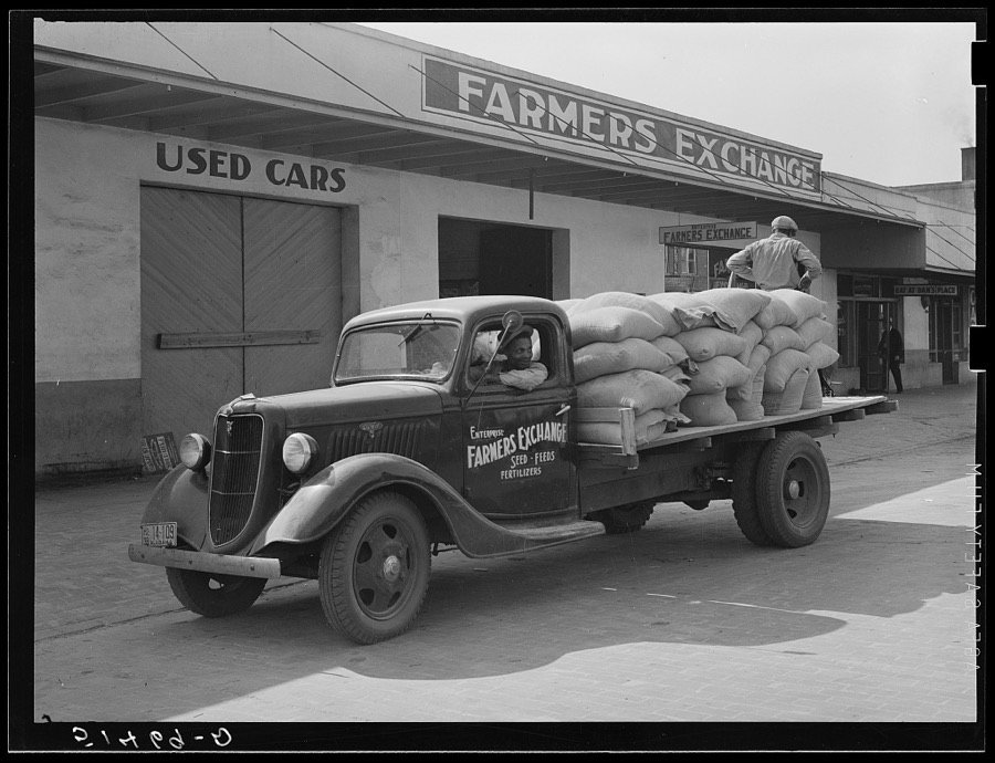 Fertilizer on truck in front of farmers' exchange. Enterprise, Coffee County, Alabama