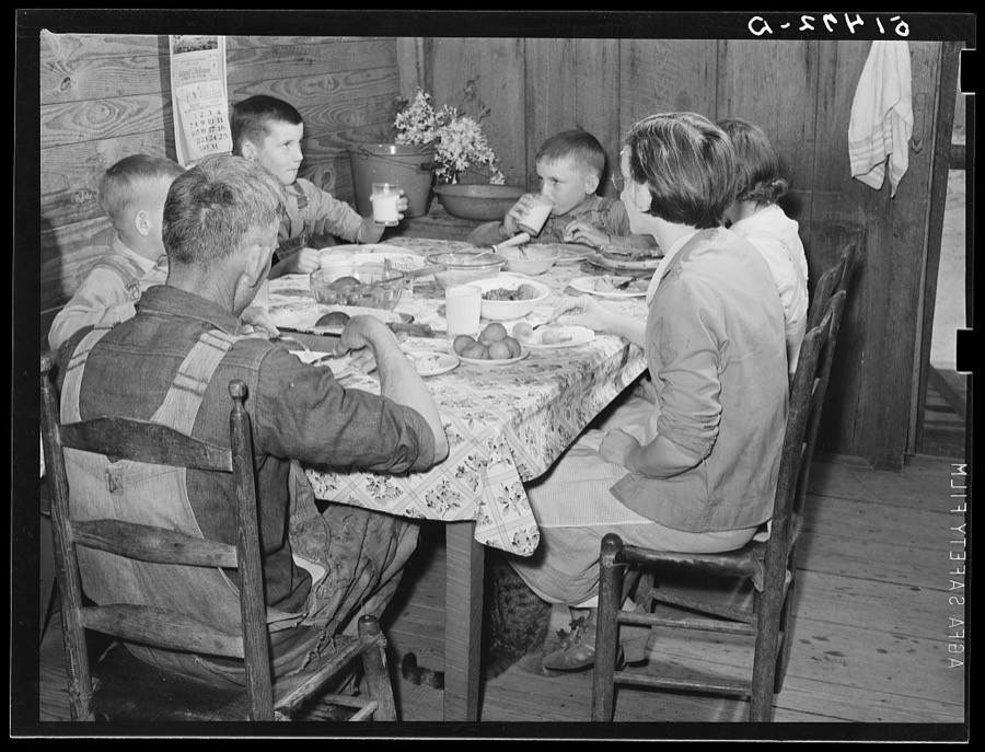 Through help and supervision of home and field supervisors, diet and health of many RR (Rural Rehabilitation) families have been greatly improved. The Peacock family (RR four years) had for dinner (noon meal): sausage, cabbages, carrots, rice, tomatoes, cornbread, canned figs, bread pudding and milk. They did not know that a picture would be made. Coffee County, Alabama