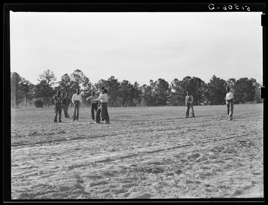 Watching a Saturday afternoon ballgame (the first one). It has been very difficult to start recreational activities because of objections of old preacher. Gee's Bend, Alabama