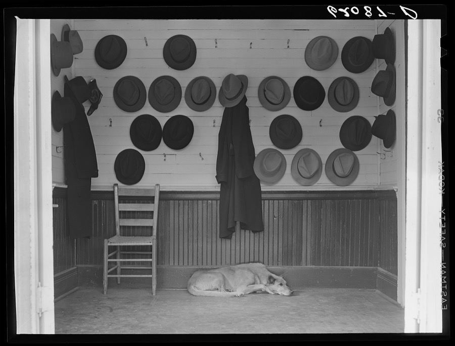 Vestibule of Baptist church during Sunday services. Hats belonging to steel and cotton mill workers. Gadsden, Alabama
