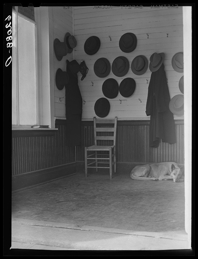 Vestibule of Baptist church during Sunday services. Hats belonging to steel and cotton mill workers. Gadsden, Alabama