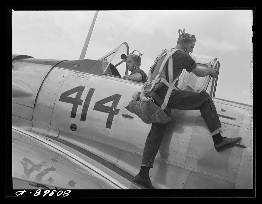 Cadet mounting plane prior to training flight. Craig Field, Southeastern Air Training Center, Selma, Alabama