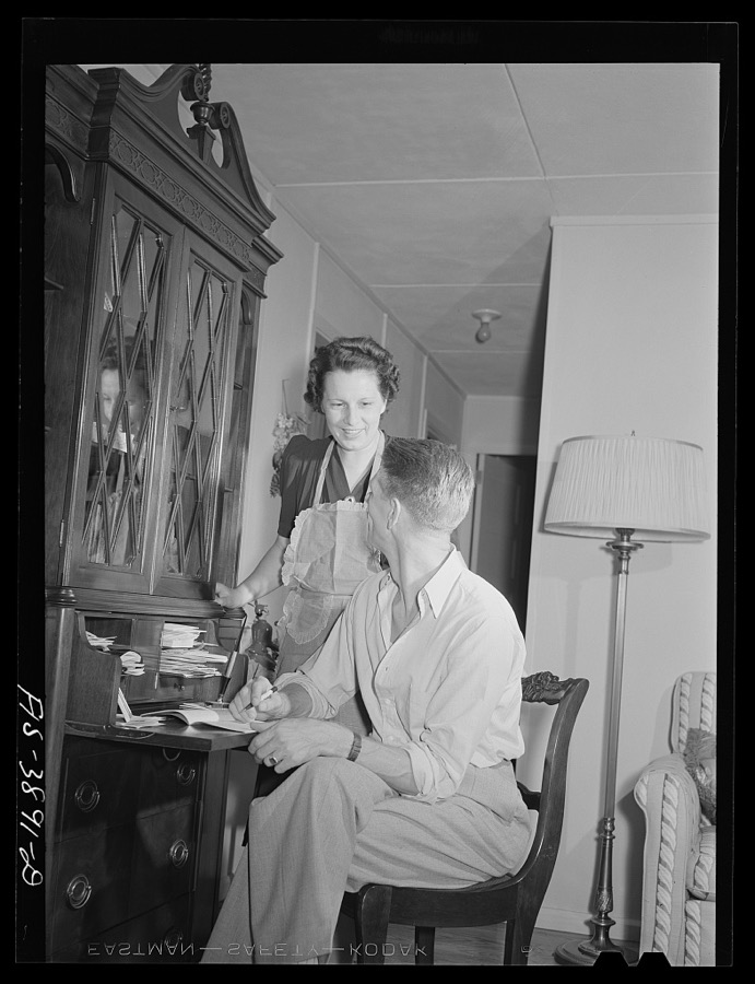 Sheffield, Alabama (Tennessee Valley Authority (TVA)). Kenneth C. Hall and family in the living room of their home on a defense housing project