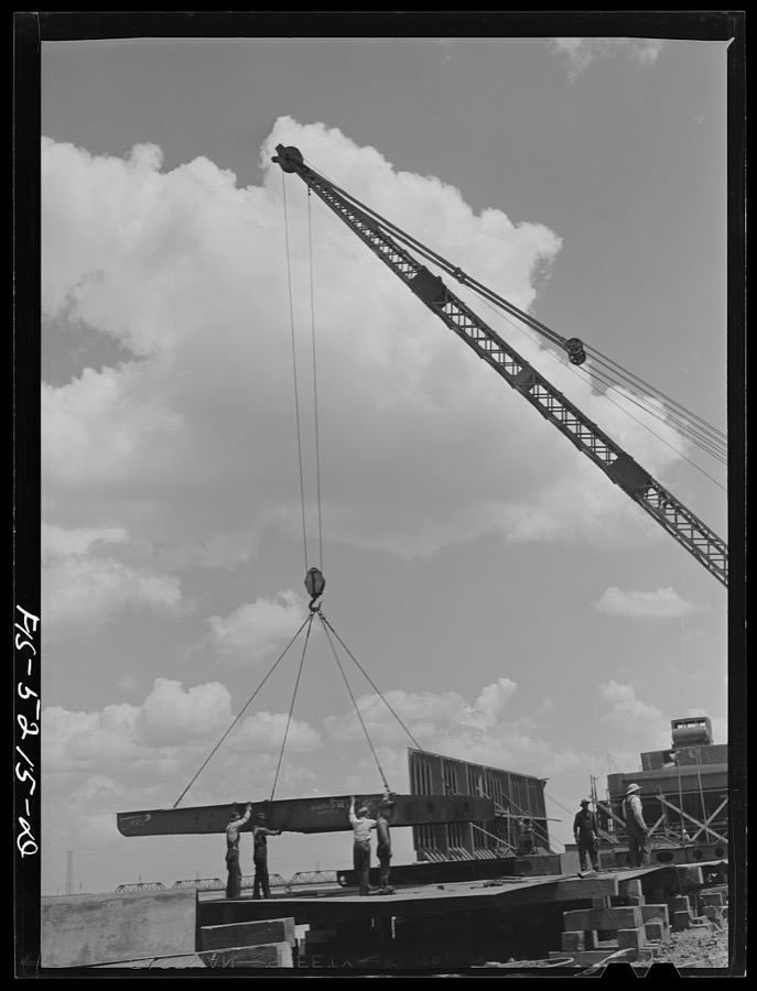 Decatur, Alabama. Ingalls Shipbuilding Company. A section of a ship's bottom being lowered into place