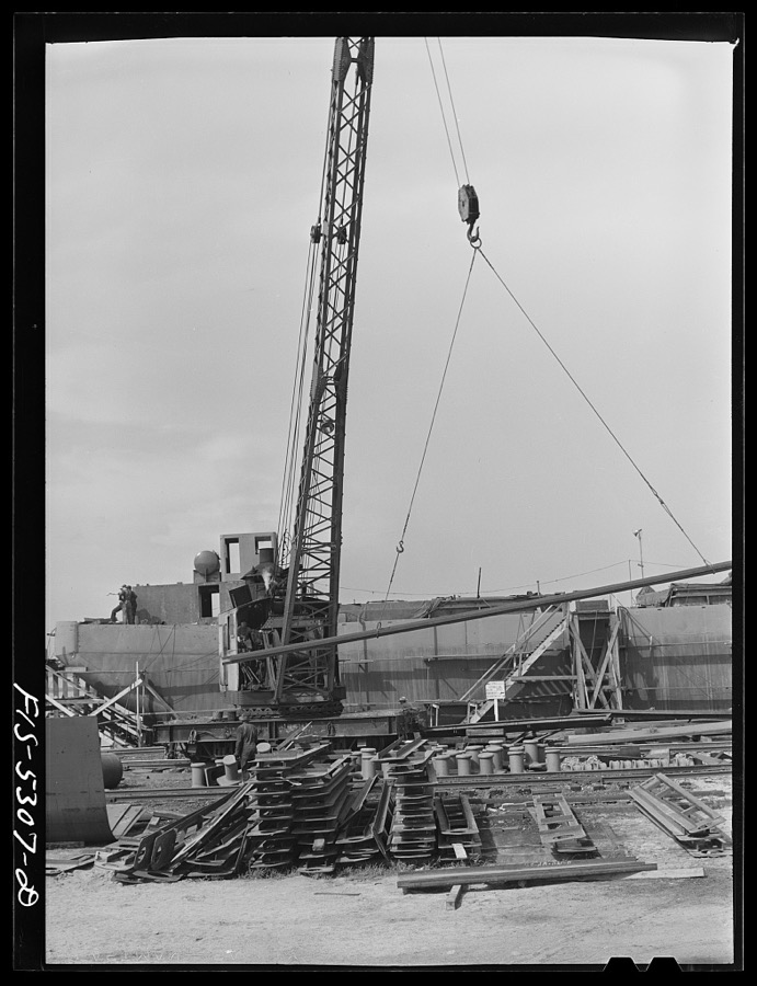 Decatur, Alabama. Ingalls Shipbuilding Company. A section of one of the sides of the stern of a barge being lowered into place
