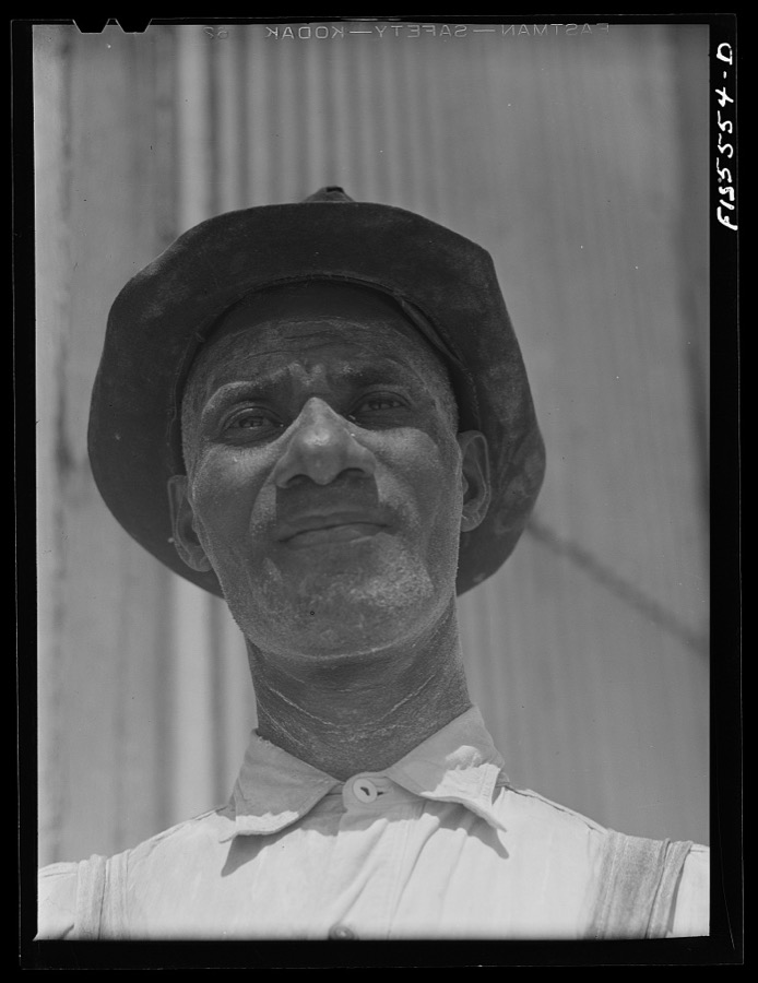 Sheffield, Alabama. Reynolds Metal Company. Workman in reduction plant. The white powder on his face is alumina