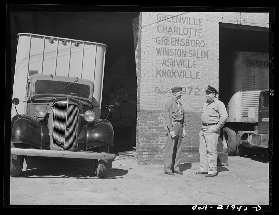 Montgomery, Alabama. Marvin Johnson talking with Seargent James Riley, who was formerly a truck driver for the Associated Transport Company