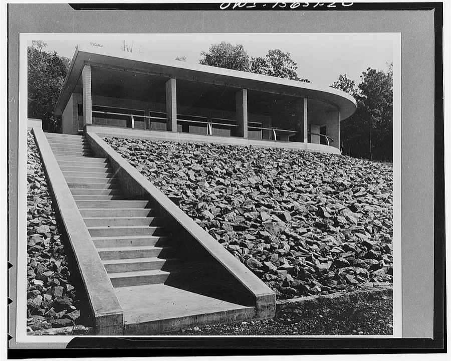 Visitors' builidngs. The visitors' building at Guntersville Dam performs similar functions as described for this type of building at Chickamauga and Pickwick. In addition, it gives access to a landing for pleasure craft through a flight of stairs. It is constructed of brick, like the generator hall across the river