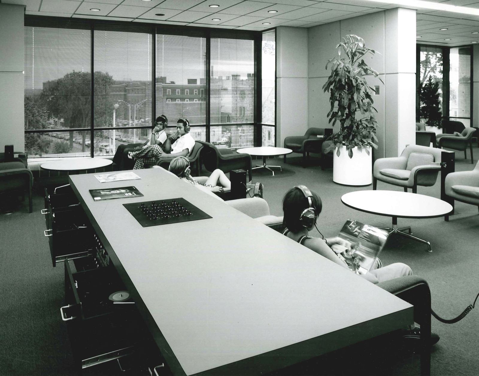 Patrons listening to music at the Lawrence Public Library, Lawrence Public Library - undated