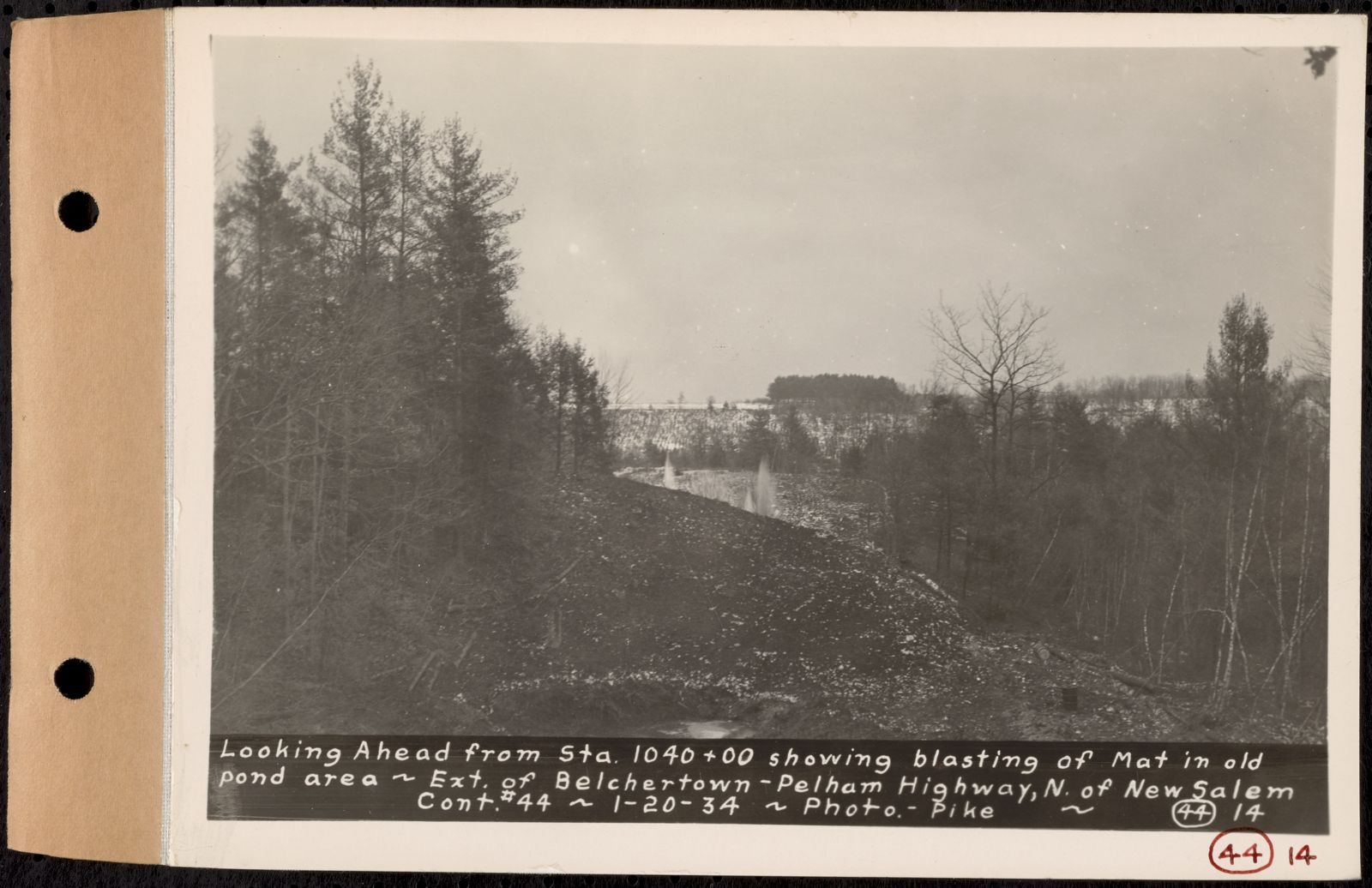 Contract No. 44, Extension of Belchertown-Pelham Highway, New Salem, Orange, looking ahead from Sta. 1040+00 showing blasting of mat in old pond area, New Salem, Mass., Jan. 20, 1934, Massachusetts Archives - undated