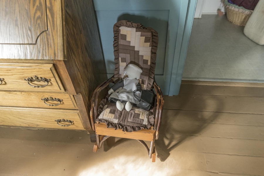 Doll on a rocking chair inside the farmhouse at Yoder's Amish Home, an authentic Amish farm that began accepting visitors in 1983 near Walnut Creek in central Ohio, along the "Amish Country Byway"
