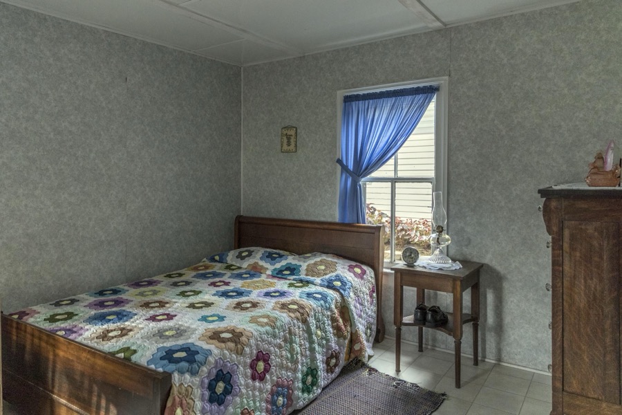 Bedroom inside the farmhouse at Yoder's Amish Home, an authentic Amish farm that began accepting visitors in 1983 near Walnut Creek in central Ohio, along the "Amish Country Byway"