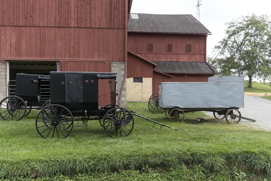 Barns and horse-drawn buggies and farm wagons at Yoder's Amish Home, an authentic Amish farm that began accepting visitors in 1983 near Walnut Creek in central Ohio, along the "Amish Country Byway"