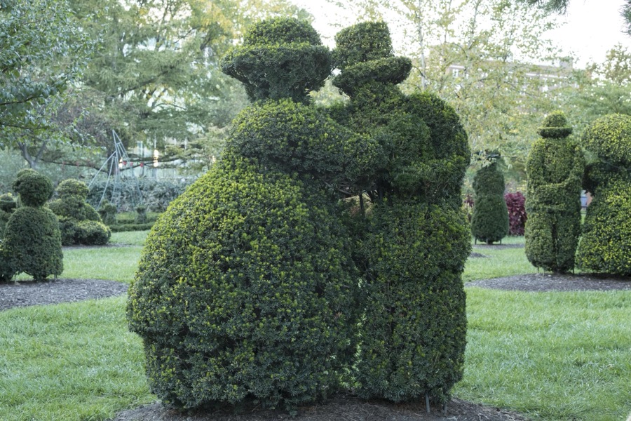 This and other clipped shrub figures in the Topiary Garden in downtown Columbus, Ohio, at the Old Deaf School Park, were created to represent those in a classic painting, "Sunday Afternoon on the Island of La Grande Jatte," by Georges Seurat