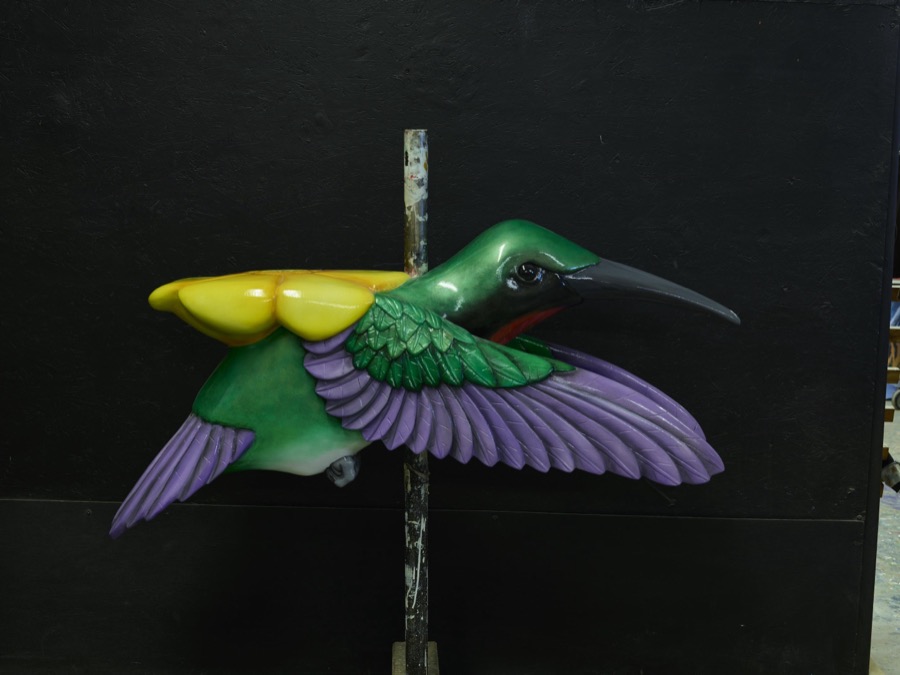 In Mansfield, Ohio, a beautiful, ridable hummingbird awaits shipment at the Carousel Works, the world's largest maker of carousels, sometimes called "merry-go-rounds"