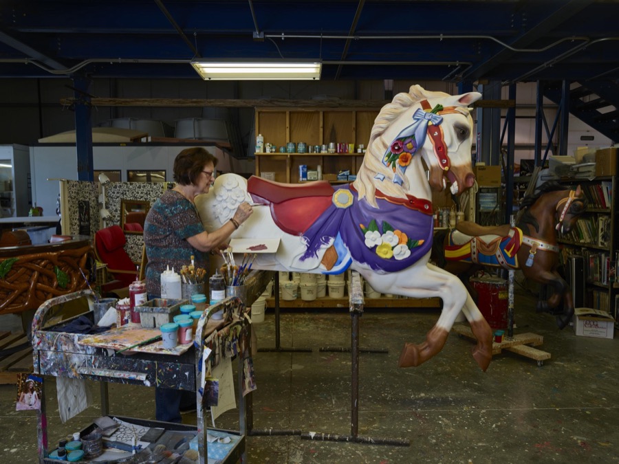 In Mansfield, Ohio, co-owner Marilyn Ritchie applies finishing touches to a beautiful carousel horse at the Carousel Works, the world's largest maker of carousels, sometimes called "merry-go-rounds"