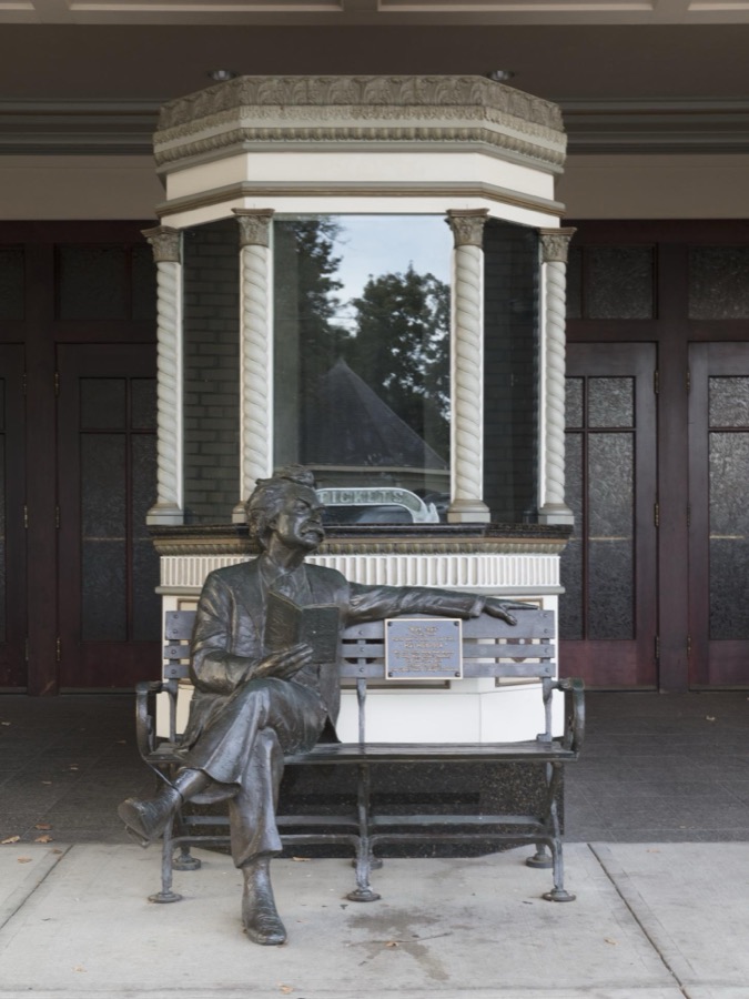 The legendary American author and storyteller Mark Twain, lounges in front of the Midland Theatre, at last in sculpure form, in Newark, Ohio