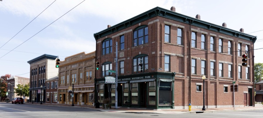 A block of West Third Street's old "Miami City" neighborhood, across the Great Miami River from downtown Dayton, Ohio, where the Wright Brothers, Wilbur and Orville, operated a print shop and later a cycle shop (around the corner to the right)