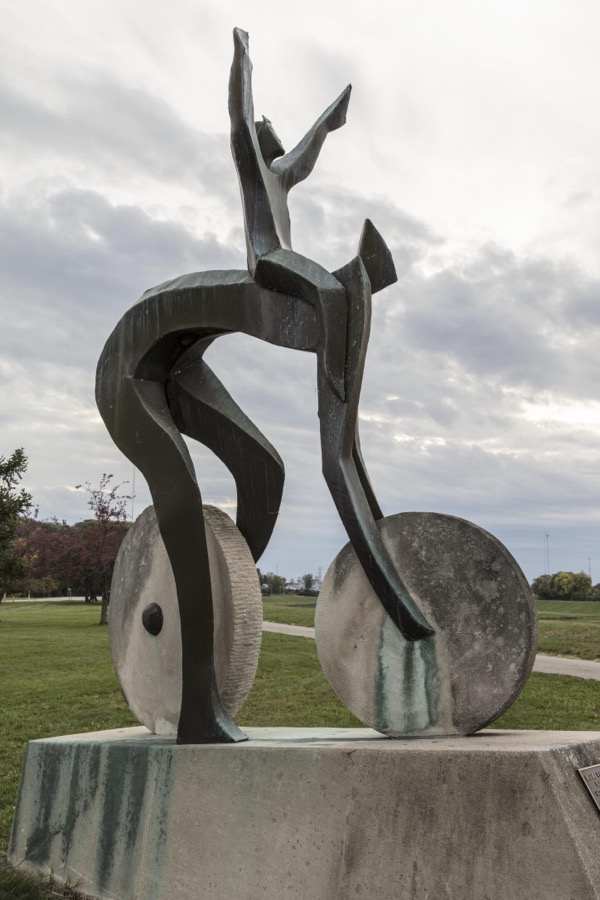 Artist Jerome B. Meadows's 1991 sculpture, "A Celebration of Bicycling," stands on the grounds of Carillon Historical Park in Dayton, Ohio, that contains historic buildings and exhibits concerning the history of technology and the history of Dayton