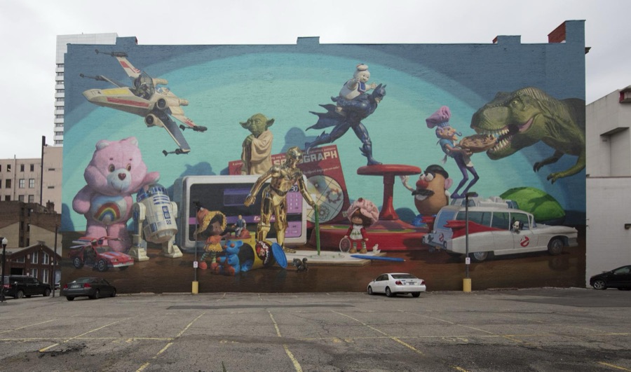 A mural, part of ArtWorks' Cincinnati Heritage series, fills the entire side of a building in downtown Cincinnati, Ohio, saluting the creations of Kenner Products, a Cincinnati company that introduced such toys as the Star Wars figurines, the Easy Bake Oven, the Bubbl-Matic Gun, and Strawberry Shortcake dolls