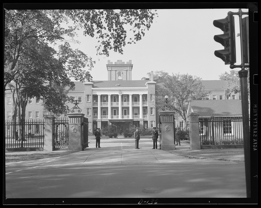 Gate of guns. Main entrance to the Administration building at an eastern armory, now turning out guns for the war program