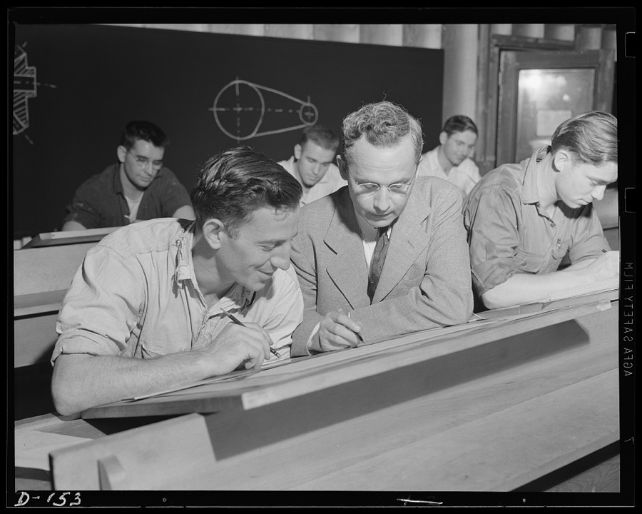Drawing a head. An apprentice gets the "range" on a drafting problem under individual instruction at a war arsenal. Thousands of young men are studying problems in plants scattered throughout the United States
