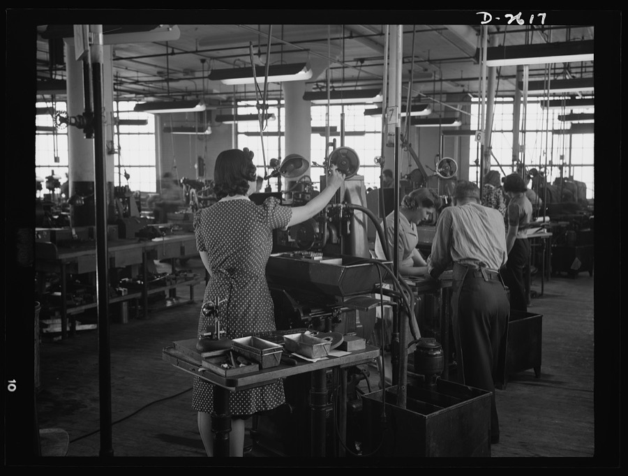Conversion. Safety razor plant. In a New England plant manufacturing safety razors, honed head blade clips for razors. Normally her full-time job, Estelle now spends much of her time grinding V-blocks on these same machines, which are rapidly being converted to war production work under a subcontract
