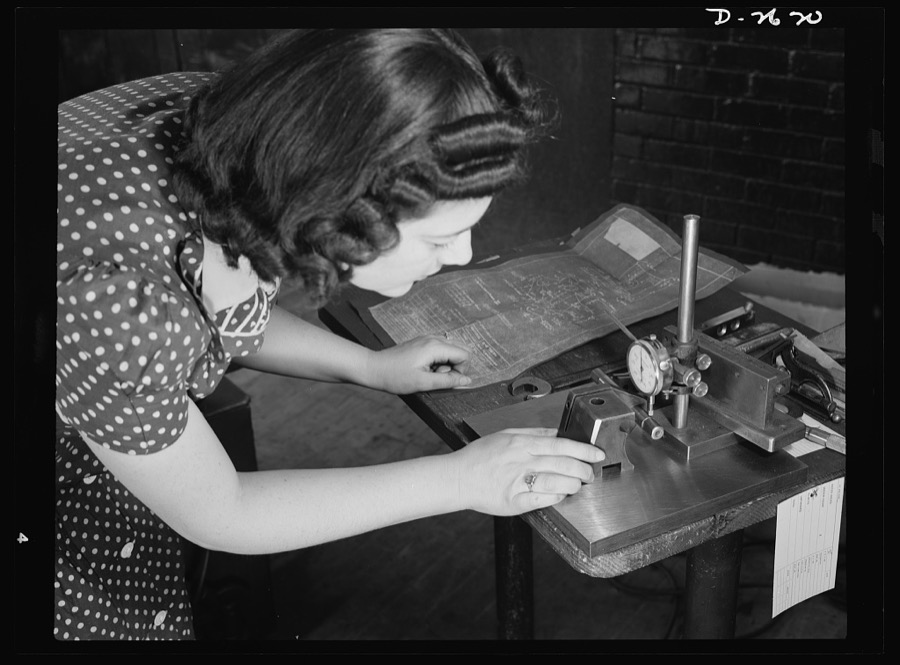 Conversion. Safety razor plant. Estelle Wilson, one of a New England razor factory's many women workers, checks completed V-blocks with blueprint specification. Because of their previous training, reading blueprints is no novelty to women employed in this plant which is now producing tool posts under subcontract. Gillette