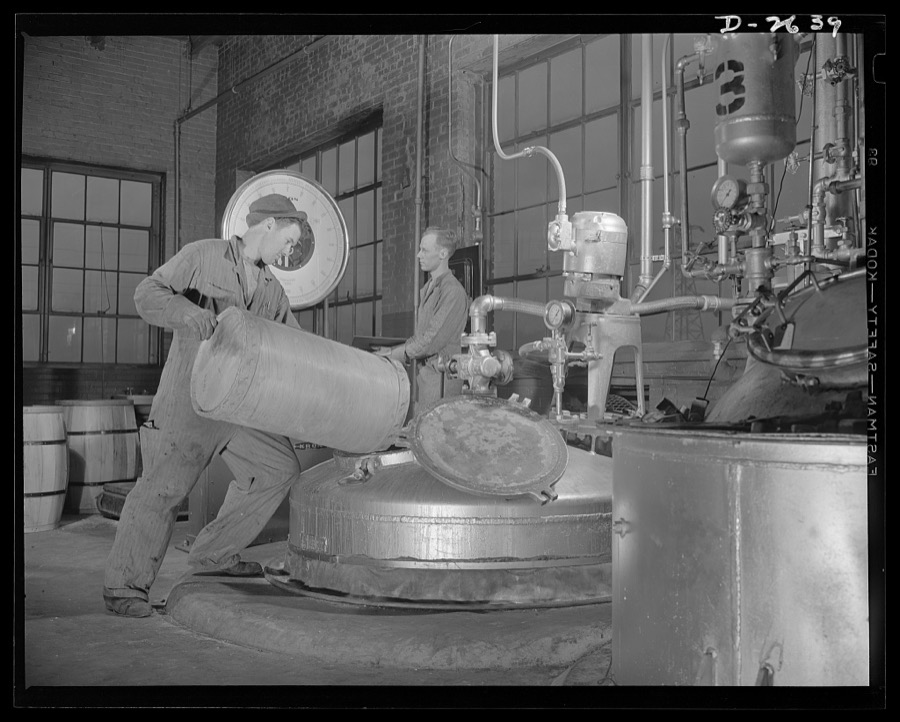Synthetic rubber (Ameripol). Carefully selected soap is used in the making of solutions used during the manufacture of synthetic rubber. This worker is mixing a solution at the B.F. Goodrich plant, in Akron, Ohio. It is mixed in a nickel-lined tank. Goodrich