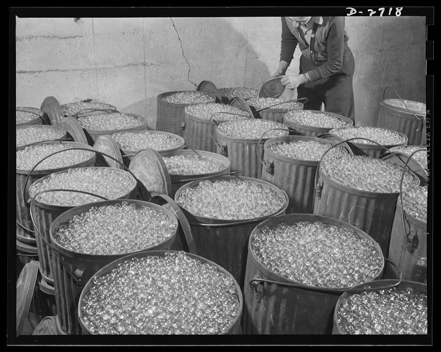 Fiberglass manufacture, Owens-Corning, Toledo, Ohio. Millions of carefully inspected glass marbles, ready for remelting and forming into glass filaments. A single marble can be drawn into a continuous filament so fine that it would reach from New York to Philadelphia. More than one hundred filaments must be drawn together to make the finest workable strand