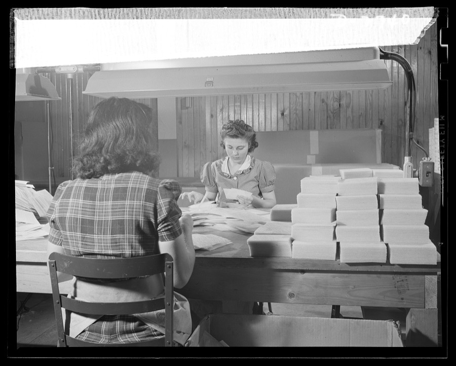 Fiberglass manufacture, Owens-Corning, Toledo, Ohio. Wafer-thin sheets of bonded glass fiber are cut to size, inspected and packaged by workers like these in a plant of Owens-Corning Fiberglass Corporation. They are retainer mats being supplied under Army and Navy specifications for storage batteries in submarines, tanks, and rough-riding reconnaisance cars