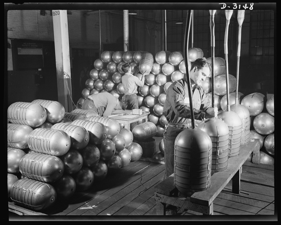 Conversion. Beverage containers to aviation oxygen cylinders. After shatterproof oxygen cylinders for high altitude flying have passed all tests in the metal division of a large Eastern rubber factory, hot air is blown through the cylinders to remove all trace of moisture (left). The cylinders are then sealed (right) and piled into stacks for painting (center). Firestone, Akron, Ohio