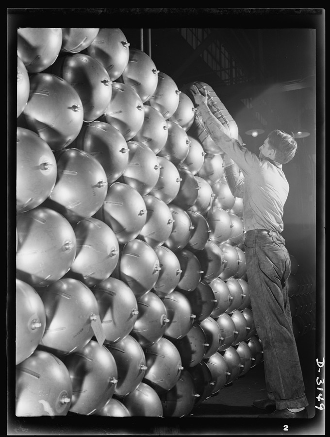 Conversion. Beverage containers to aviation oxygen cylinders. An oxygen cylinder for high altitude flying, manufactured by the metal division of a large Eastern rubber factory is completed, and after having passed all tests, it is placed on the huge stack ready for shipment to the U.S. Army. Firestone, Akron, Ohio