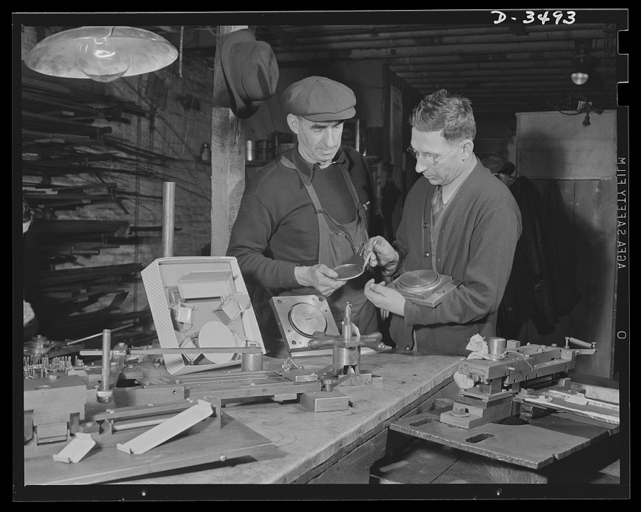 Conversion. Toy furniture to dies for incendiary bombs. Owner and foreman of this small Midwest factory check final pieces of doll's metal furniture before the shop is given over entirely to war production. In foreground are tools and dies which made the toys. All of the equipment will be converted to production of incendiary bomb fixtures. Sivon Machine Company, Painesville, Ohio