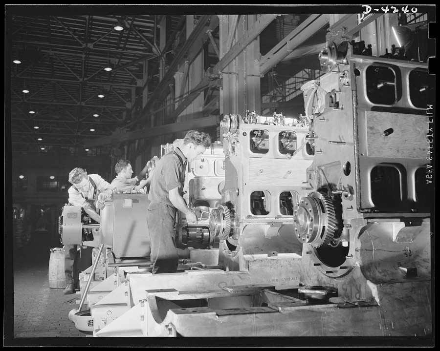 Production. Diesel engines. Assembling the drive ends of diesel engines being made for the Navy at a Midwest manufacturing plant