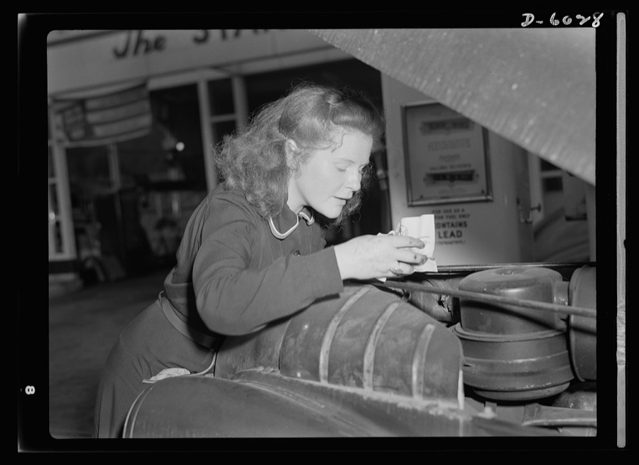 Women in war. Filling station attendant. Tires need checking too? Shifting trends of employment in wartime America have opened up new jobs for such women as this young East Liverpool, Ohio, girl who has pioneered in two new fields since graduation from high school. She learned butchering first, and built up quite a reputation as a purveyor of choice cuts. Now she's one of the most efficient service station attendants in the neighborhood. Her name? Virginia Excell