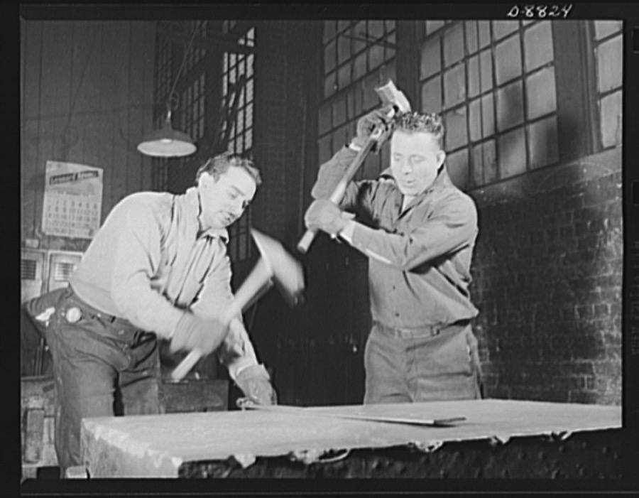 Production. Halftrac armoured cars. Straightening a piece of steel plate that will be used in the production of a body for a halftrac scout car. Great numbers of bodies are turned out in this plant, which formerly made locks and safes. Diebold Safe and Lock Company, Canton, Ohio