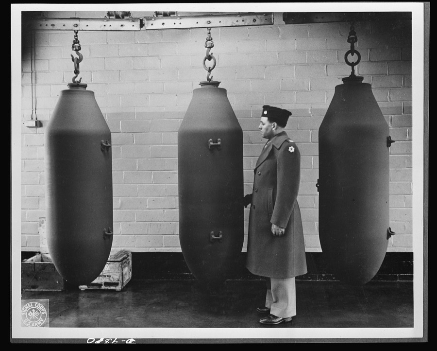 Production. Shell loading. These 2,000-pound bombs will carry death and destruction to the Axis from a huge shell-loading plant in the Midwest. The arsenal makes even deadlier gifts for Hitler--4,000-pound "block busters" and shells of still greater size. Ravenna ordnance plant