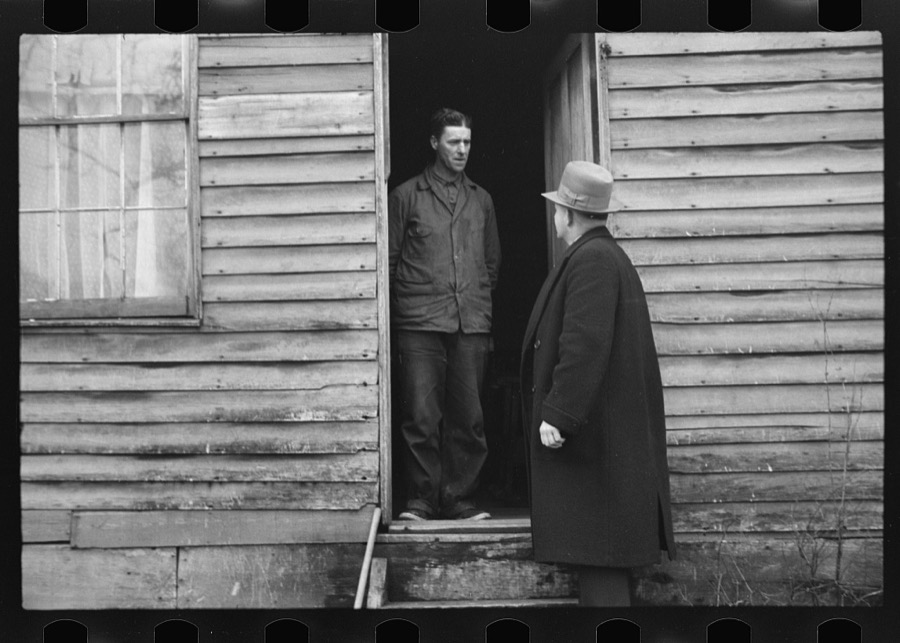 Resettlement Administration representative at door of rehabilitation client's house, Jackson County, Ohio