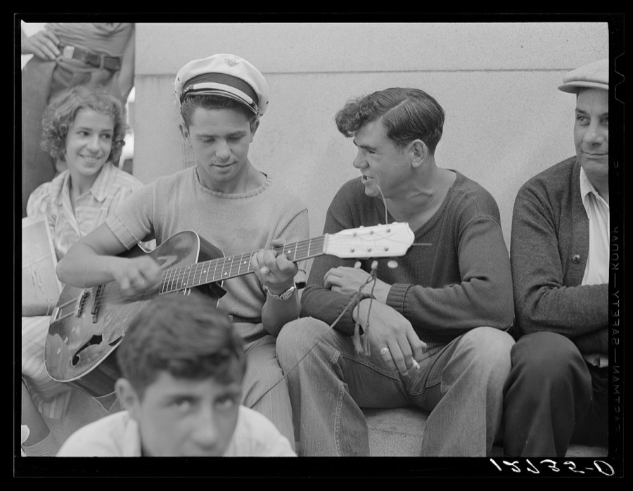 Local talent makes music on a Sunday afternoon under soldiers' monument. Provincetown, Massachusetts