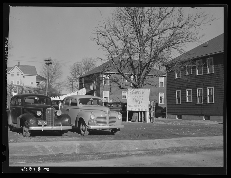 Sign advertising parking space in backlot of a private house in the vicinity of the shipyards in Quincy, Massachusetts