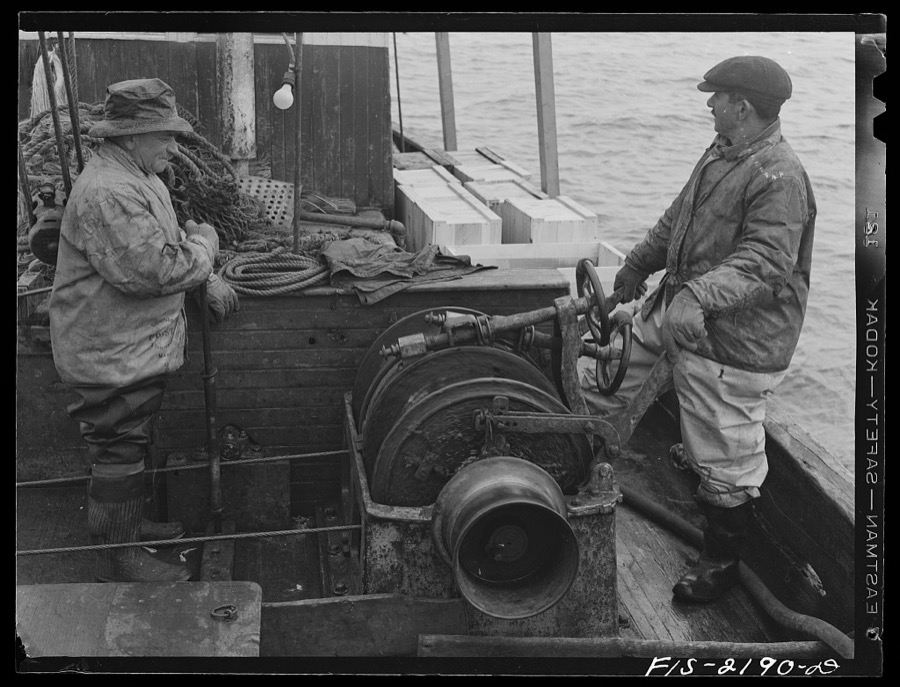 Provincetown, Massachusetts. Portuguese fisherman manning the winch which hauls in the trawl