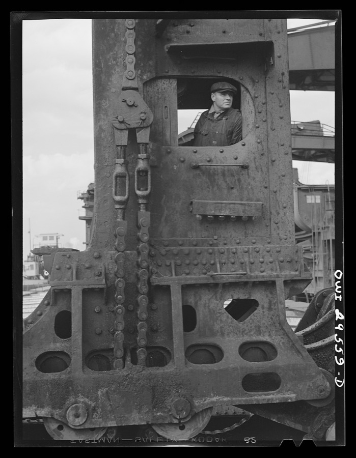 Cleveland, Ohio. Hewlett [i.e., Hulett] crane operator in his cab at the Pennsylvania Railroad iron ore docks