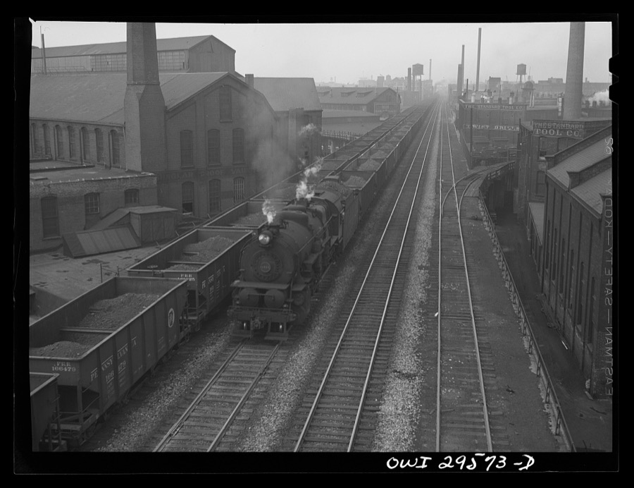 Cleveland, Ohio. On the left, a Pennsylvania Railroad iron ore train about to leave for the steel mills; right, a Pennsylvania Railroad train is coming in from the coal mines
