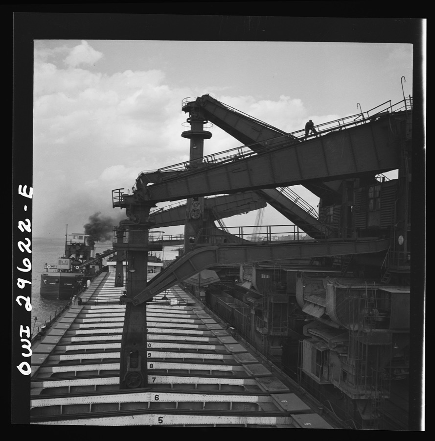 Cleveland, Ohio. Unloading iron ore from a lake freighter by means of Hewlett [i.e., Hulett] unloaders at the Pennsylvania Railroad docks